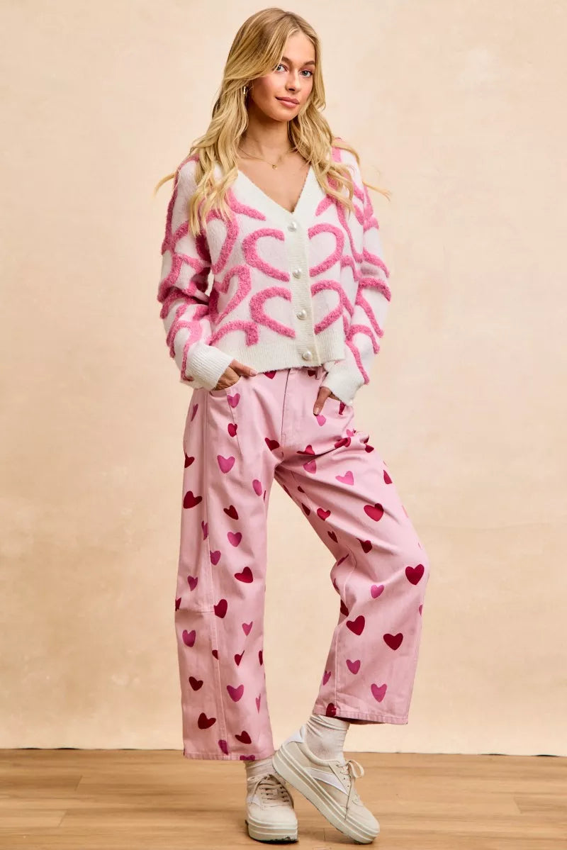 Pink and white heart-pattern V-neck cardigan with button front and long sleeves