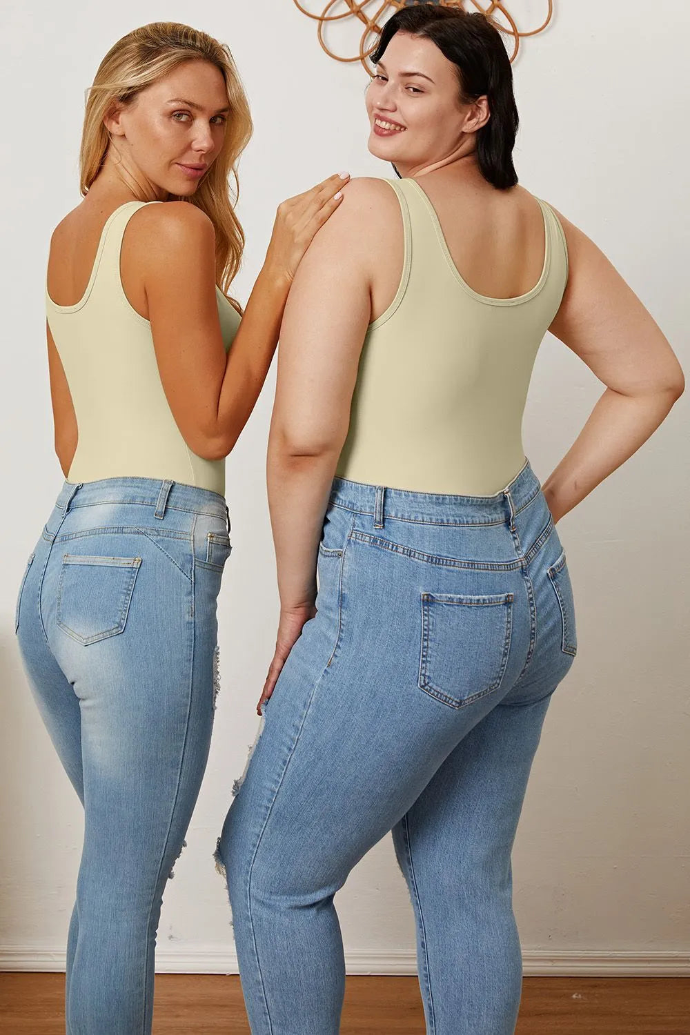 Light cream sleeveless bodysuit with scoop neckline, full coverage