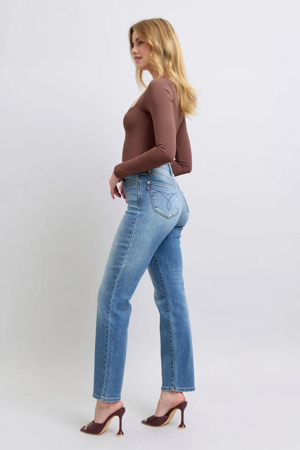 Medium-wash vintage straight jeans profile with straight leg opening and back yoke seam