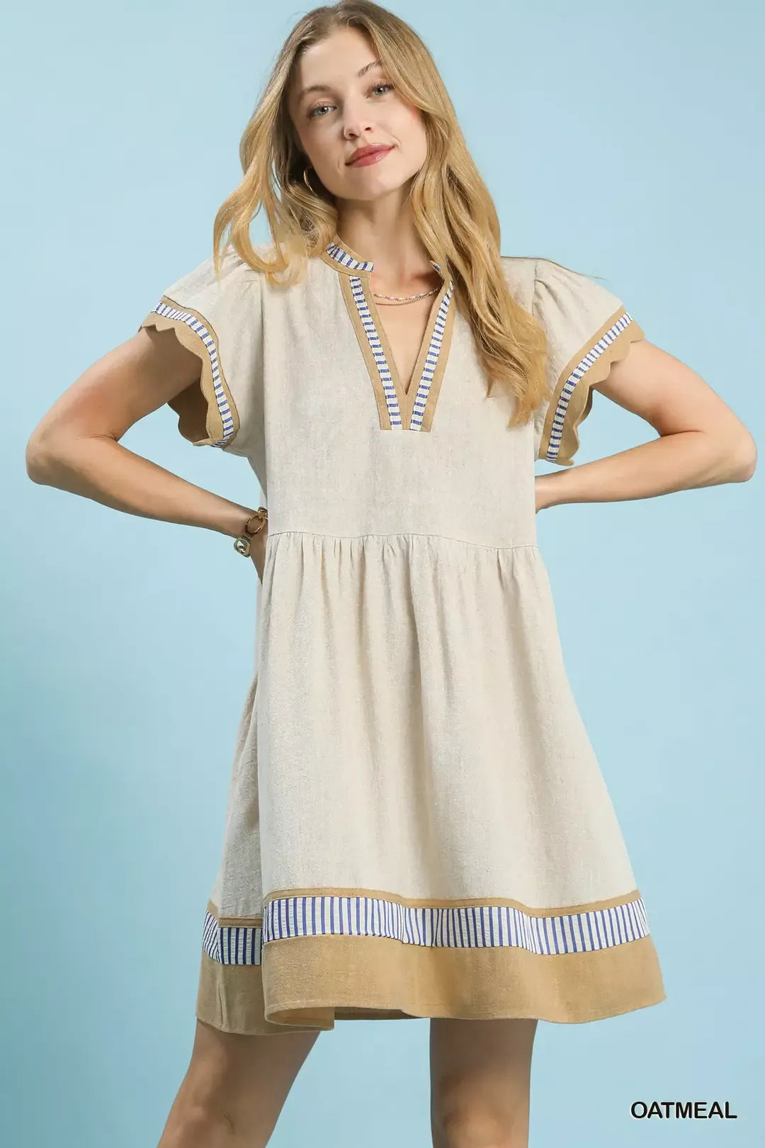 Oatmeal linen color block dress with flutter sleeves and blue striped V-neck trim