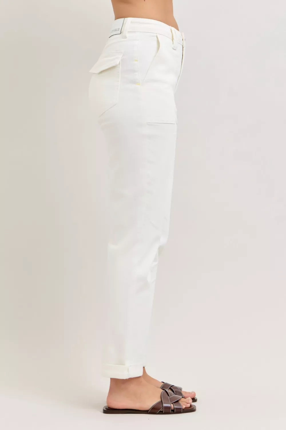 Side view white high-waist jeans with patch pockets and tapered leg