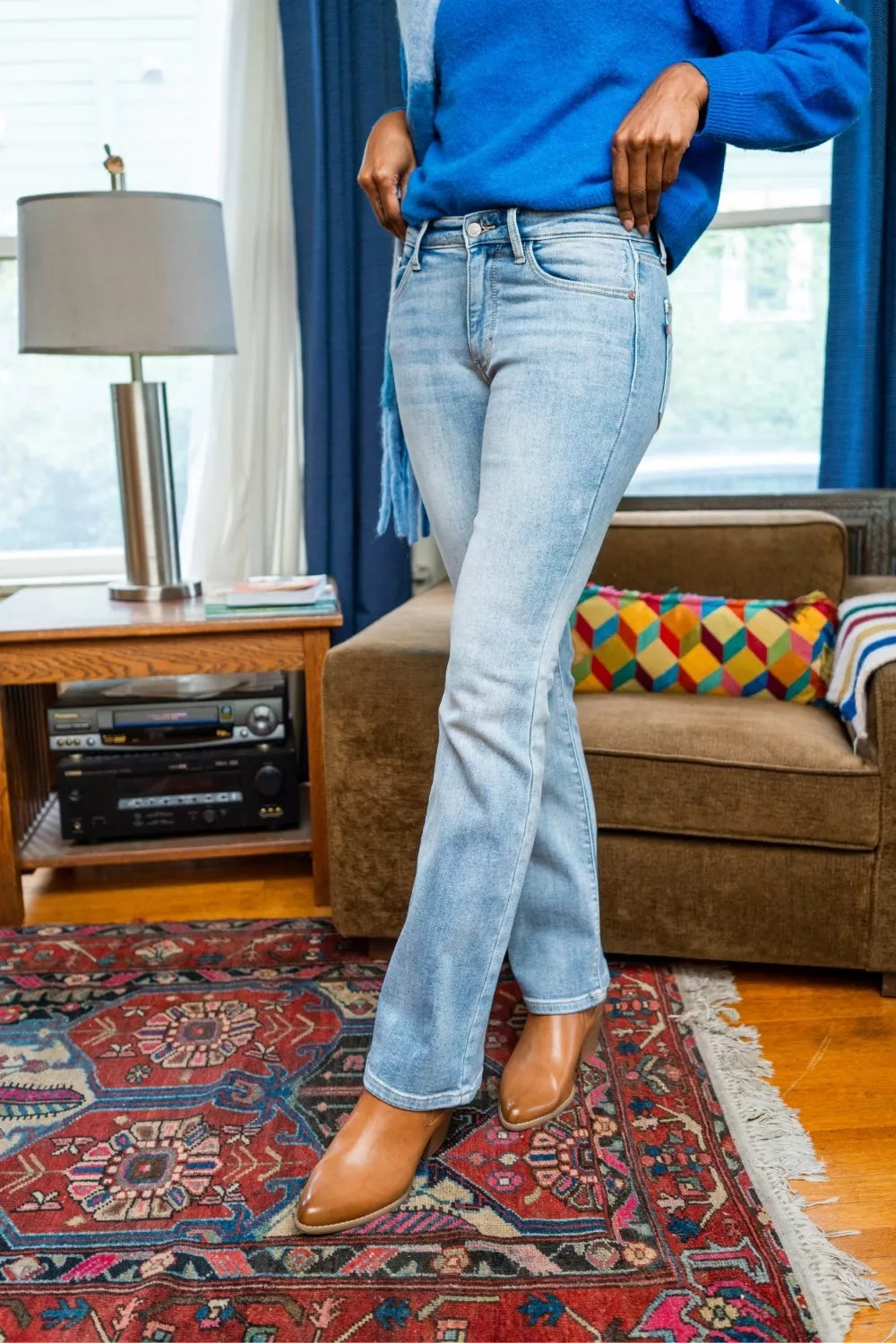 Light wash mid-rise bootcut jeans, straight leg to slight flare at hem