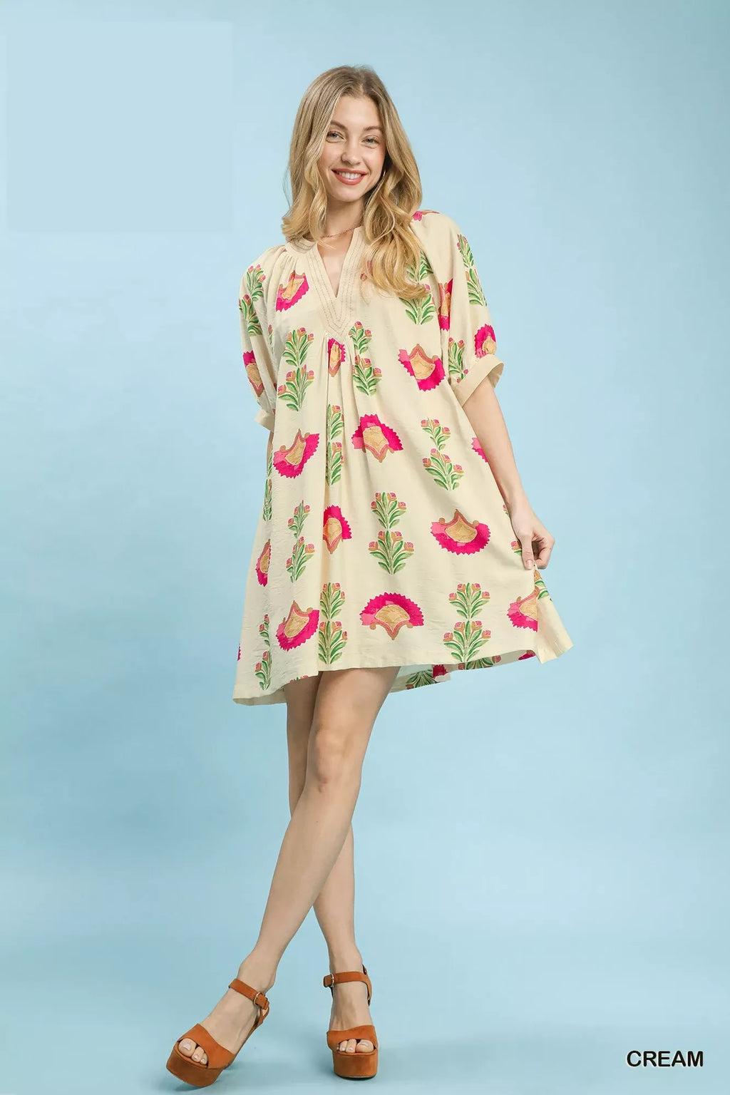 Cream abstract print mini dress with short sleeves and relaxed fit, full body