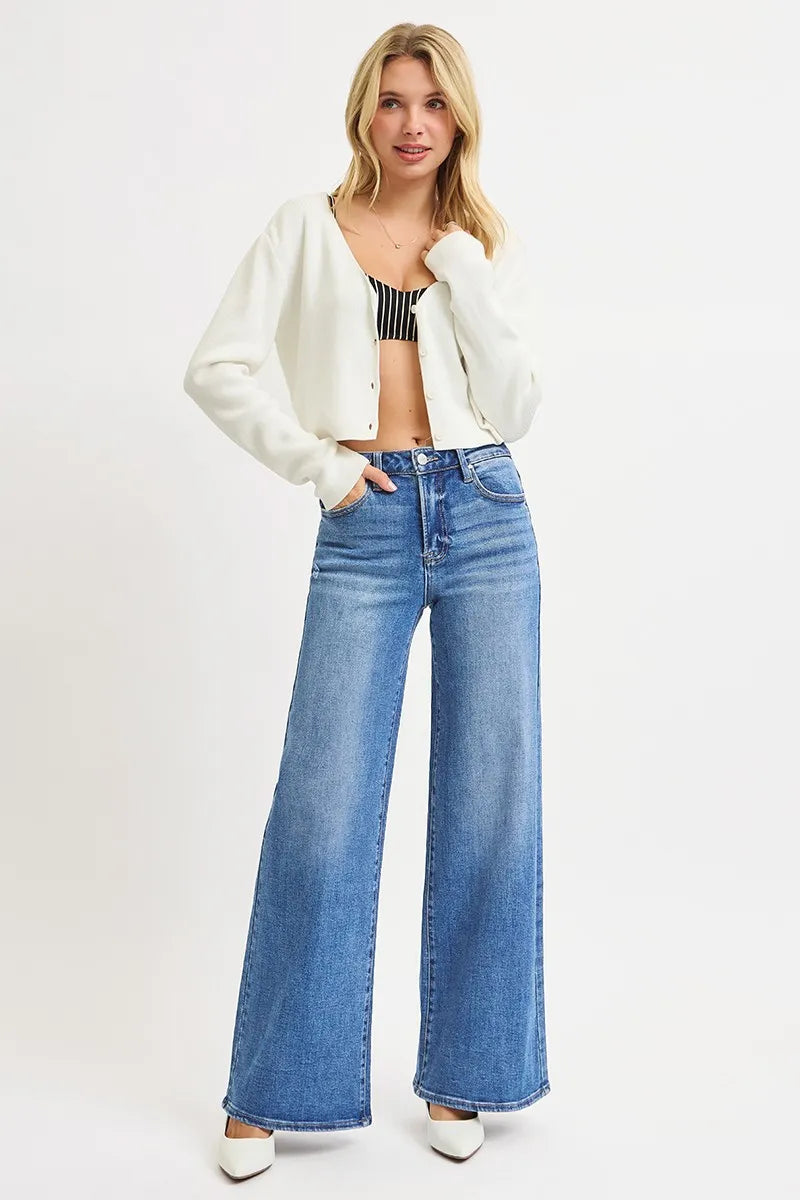 High-rise wide-leg plus jeans, medium wash blue with full-length wide flare legs.