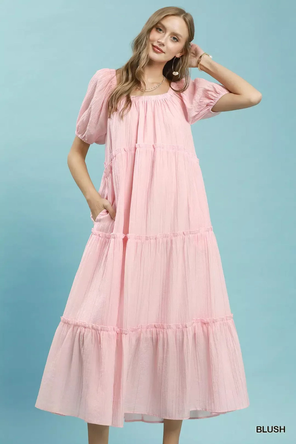 Blush tiered midi dress with gathered bodice and puff sleeves