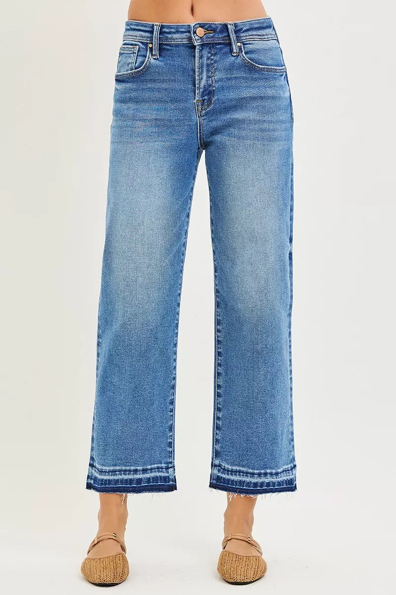 Medium-wash cropped boyfriend jeans, relaxed wide legs, frayed hem trim