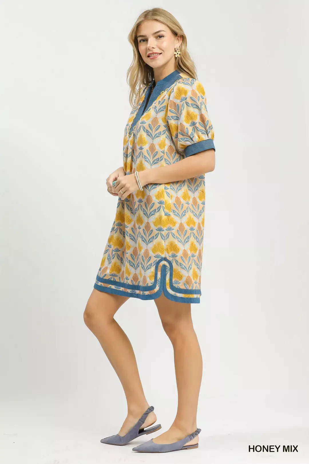 Honey mix mini dress profile with short puff sleeves and blue trim detail