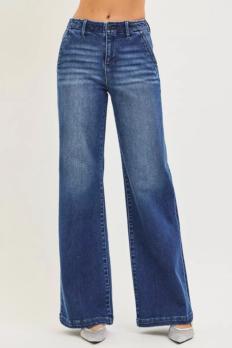 High-rise wide-leg jeans in dark wash denim with button fly and belt loops