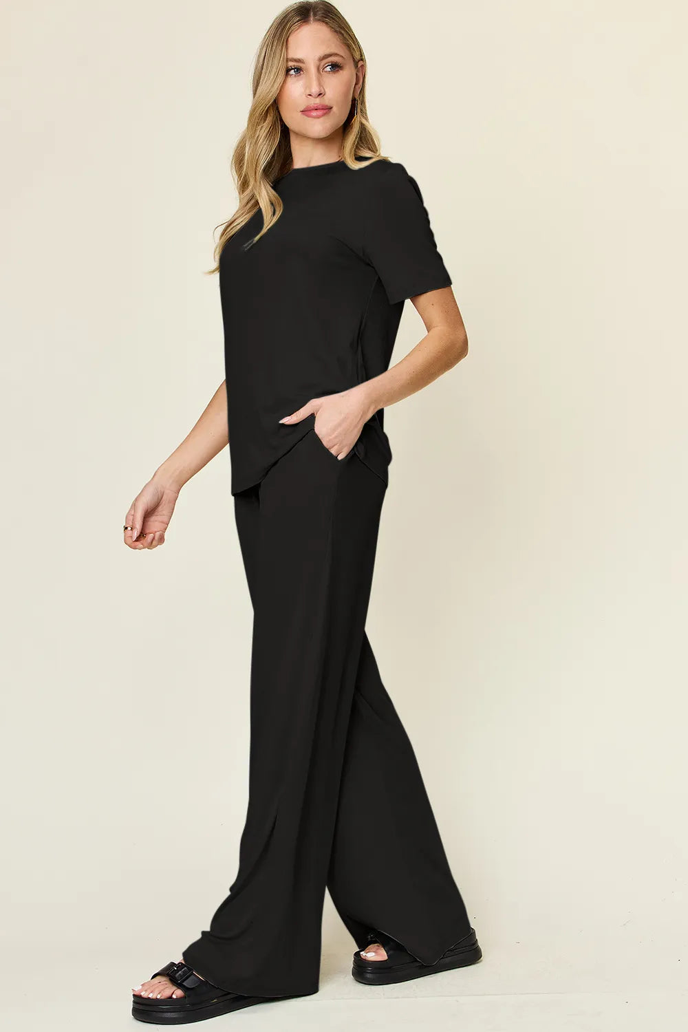 Black T-shirt and wide-leg pants set, short sleeves, side view