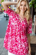 Hot pink animal-print babydoll top with crisscross neckline, short sleeves