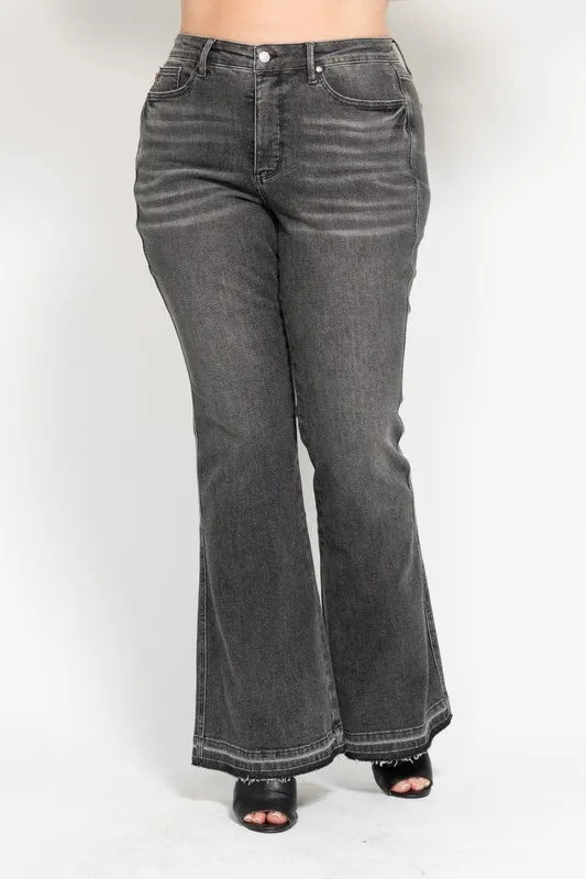 Washed gray mid-rise flared jeans with release hem, button fly, and belt loops