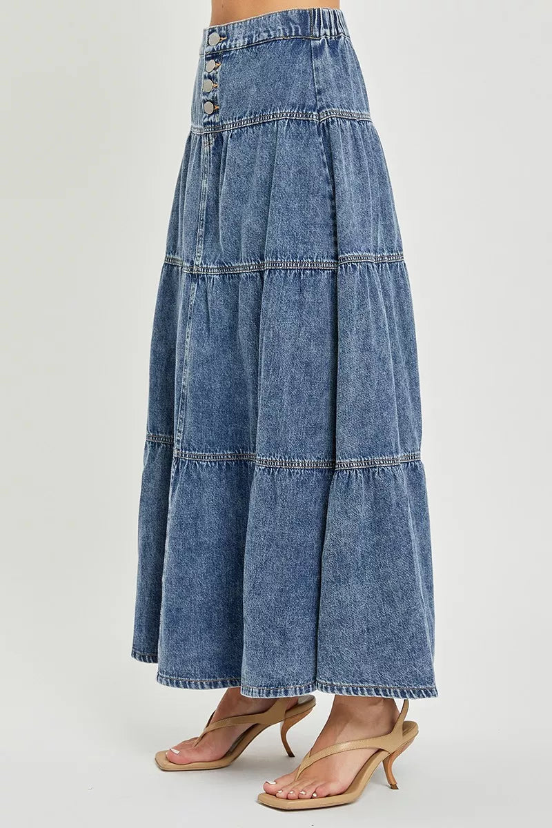 Back view of high-rise denim skirt with tiered ruffle tiers and button closure, medium wash