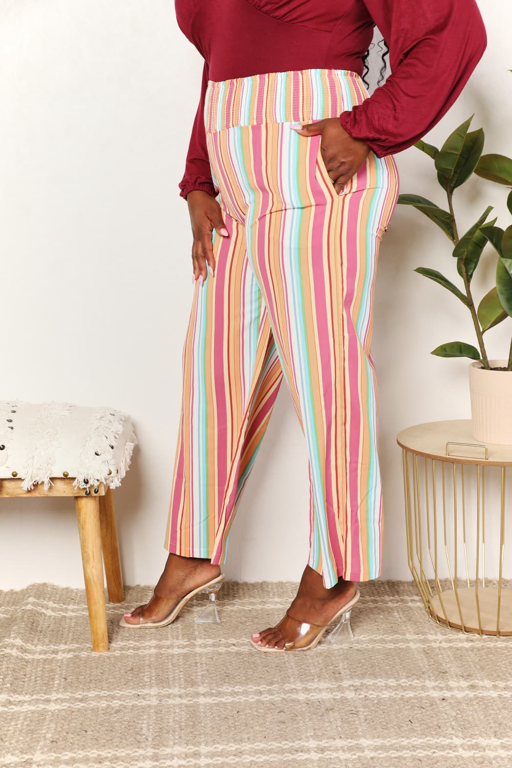 Back/side view: multicolor striped pants with smocked waist and pockets