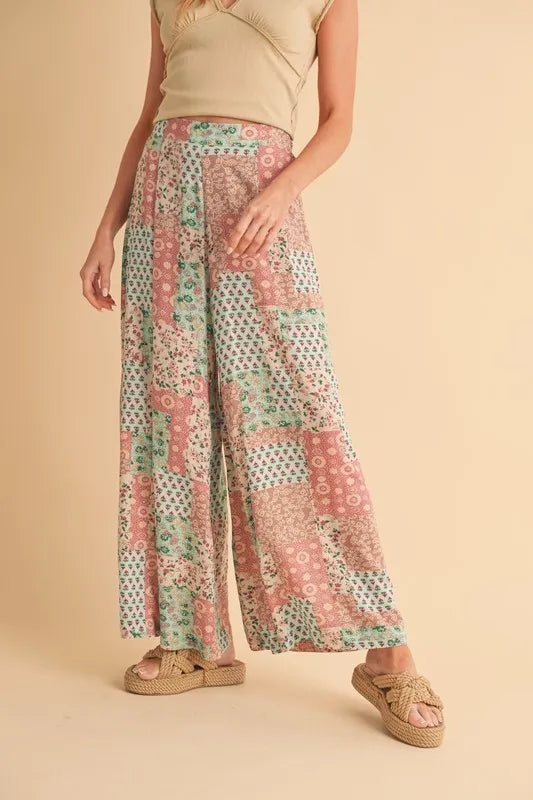 Mint/pink printed wide-leg pants with relaxed fit and patchwork panel pattern