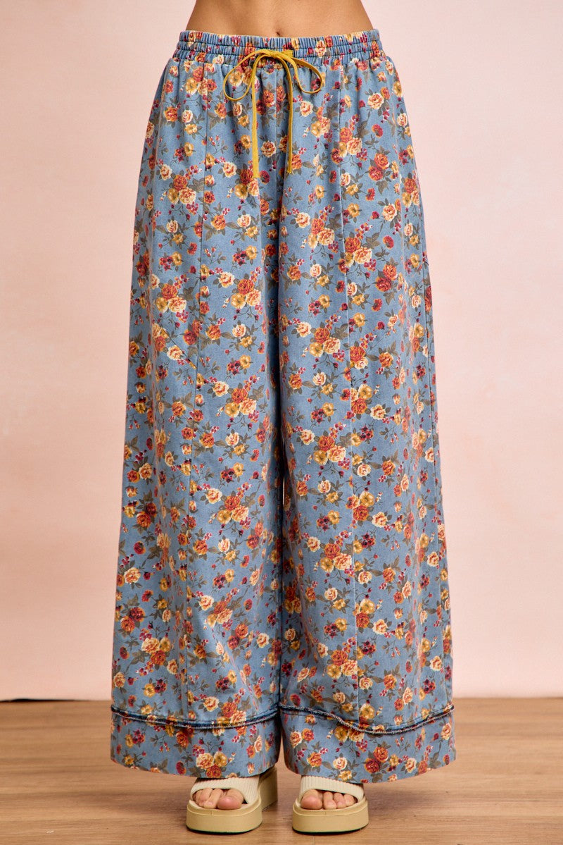 Denim-blue floral wide-leg pants with elastic waist and drawstring tie