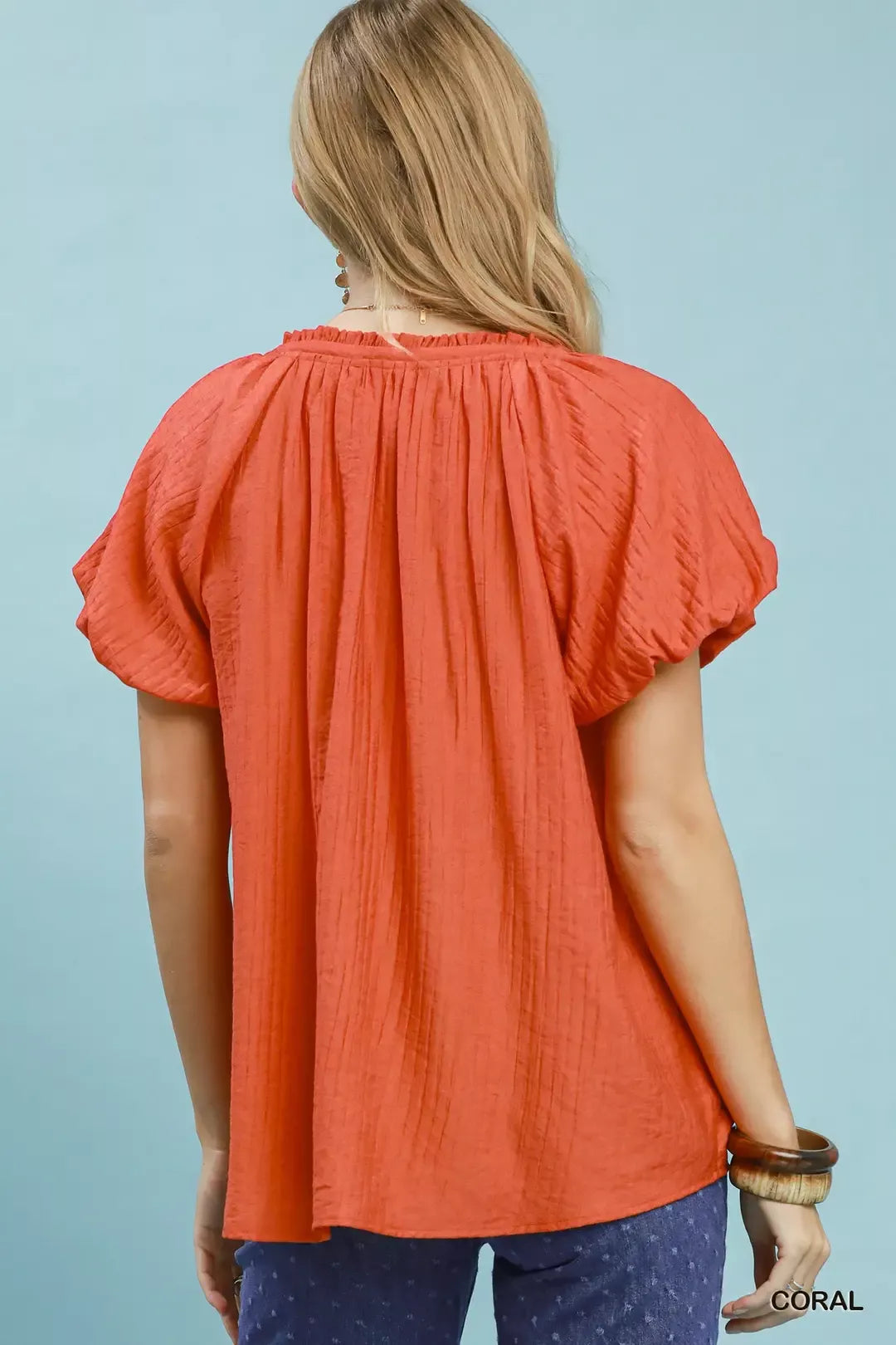 Coral gathered back pleats V-neck top with short puff sleeves
