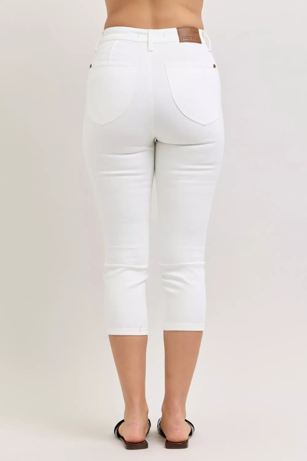 White capri jeans back with spade pockets and extended high waistband