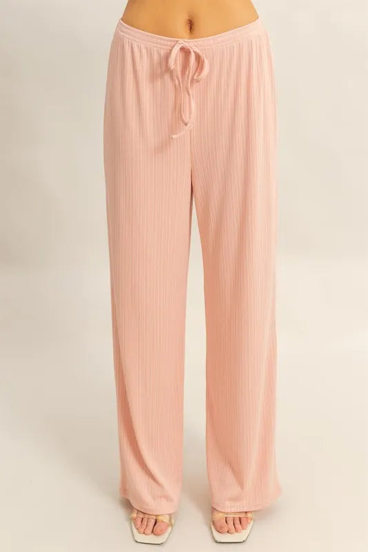 Peach wide-leg pants with drawstring tie, elastic waistband, rib-knit texture