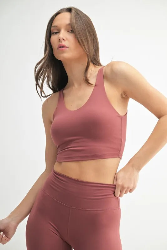 Active tank, Red Pear—side view showing fitted hem and racerback shape
