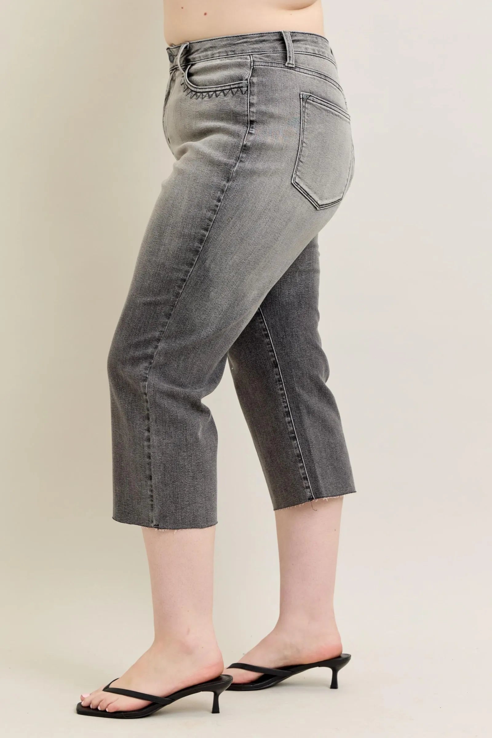 Gray wide-leg capri jeans, angled side view, slim waistband, front slash pocket