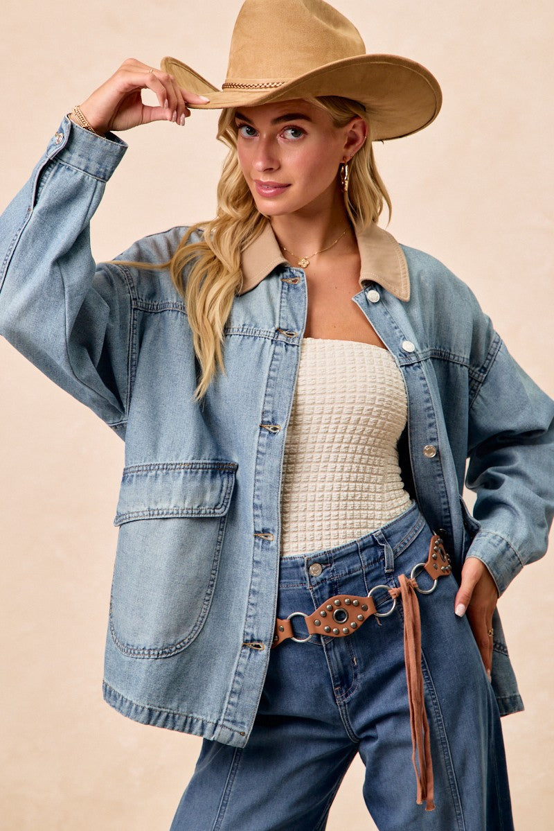 Washed denim jacket with tan contrast collar and buttoned flap pockets