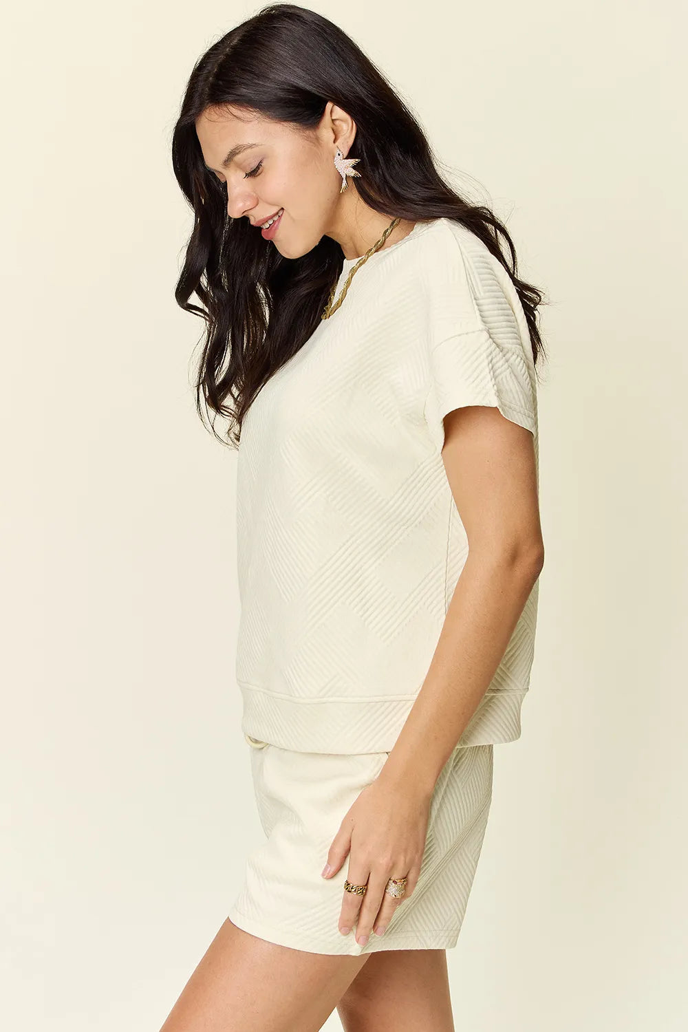 Ivory textured short-sleeve T-shirt and drawstring shorts set, side profile