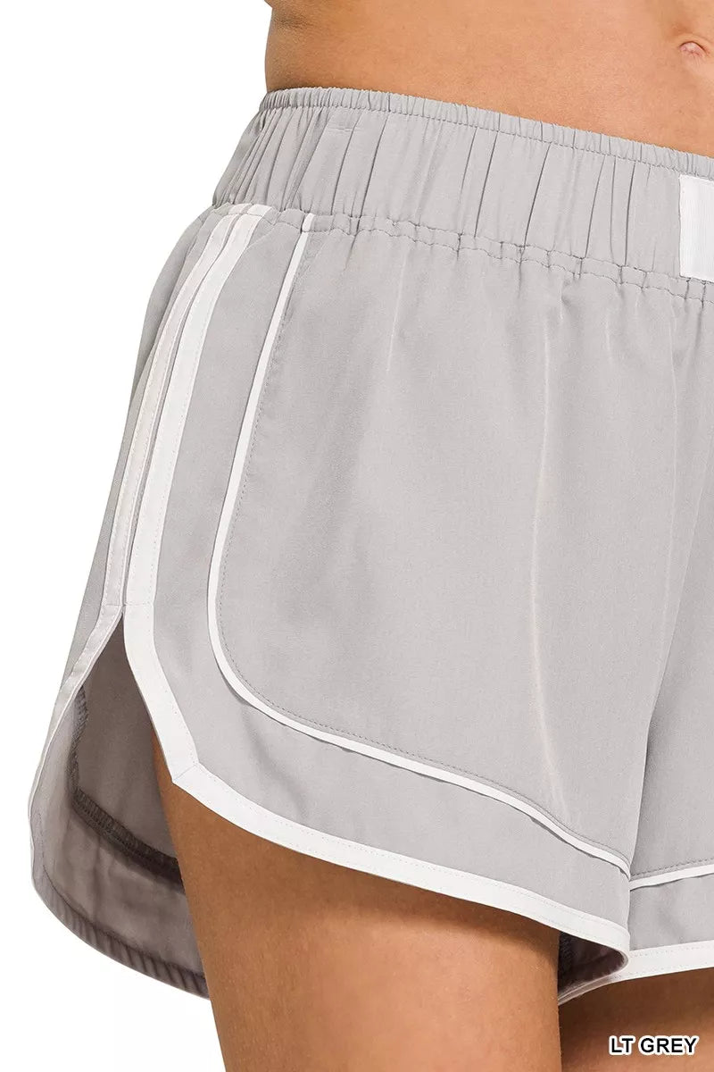 LT GREY dolphin shorts, side view with elastic waist, contrast-trimmed hem, lined