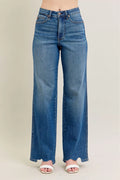High-waist wide-leg jeans in medium wash with frayed, distressed hem