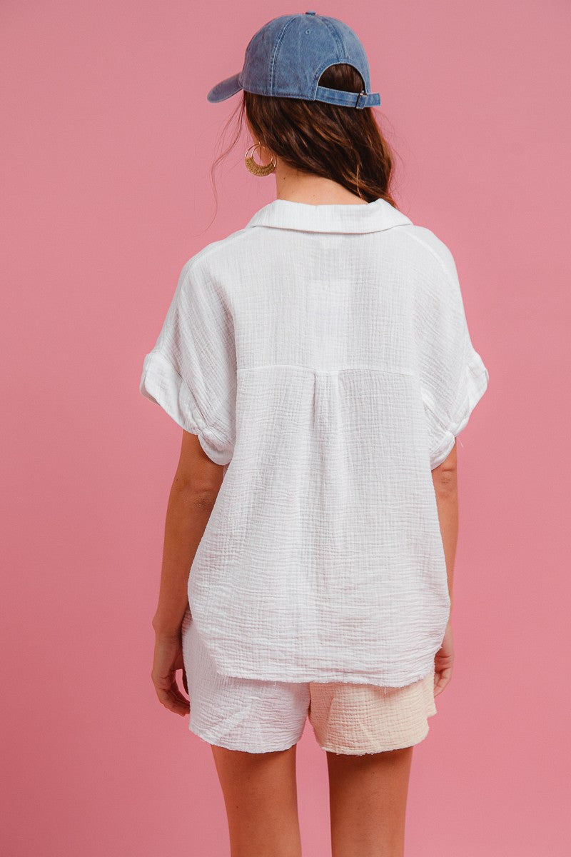 Back view of off-white wrinkled gauze shirt and matching shorts set