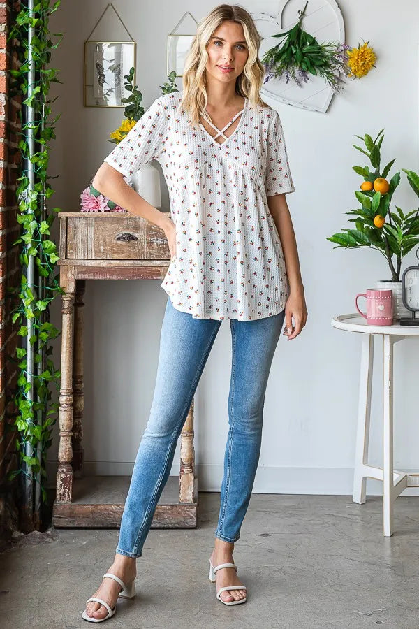 Trendsi babydoll top with white ditsy floral print, crisscross V neckline, short sleeves