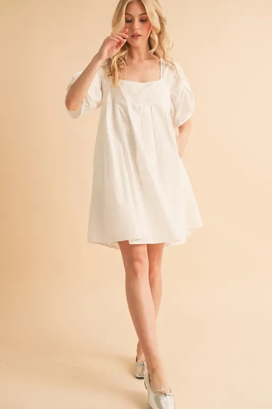White square-neck babydoll dress with short puff sleeves and loose fit