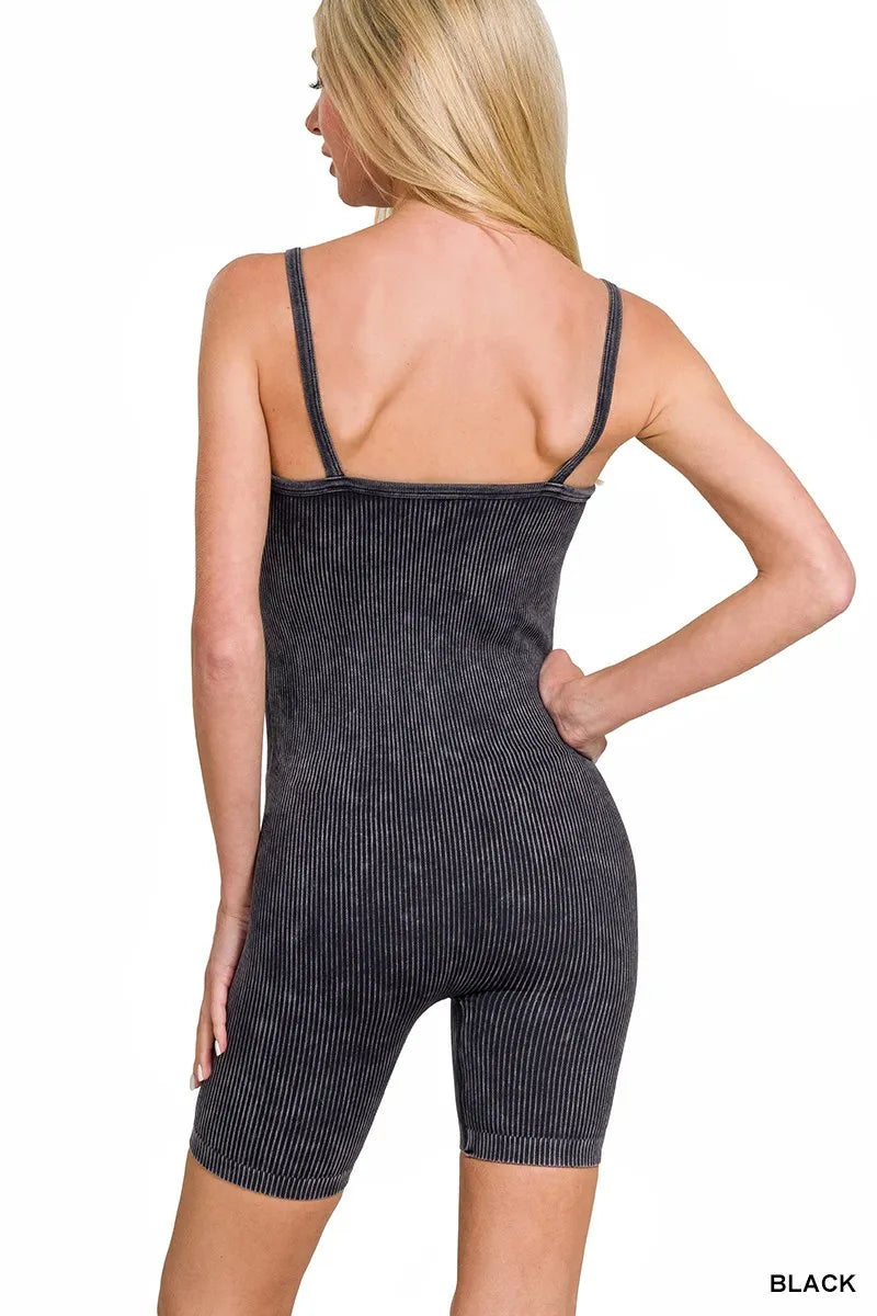 Back view of black stone-washed ribbed seamless romper with spaghetti straps