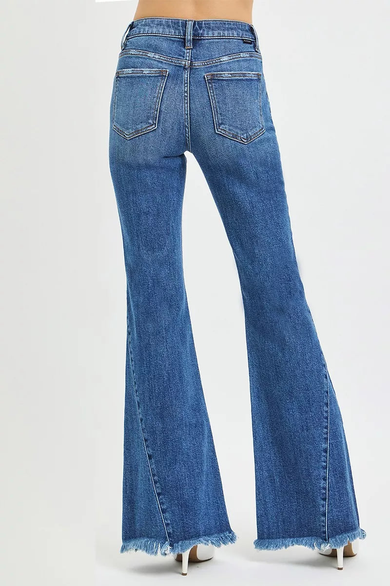 Dark blue mid-rise flare jeans back: two rear pockets, center seam, frayed hem