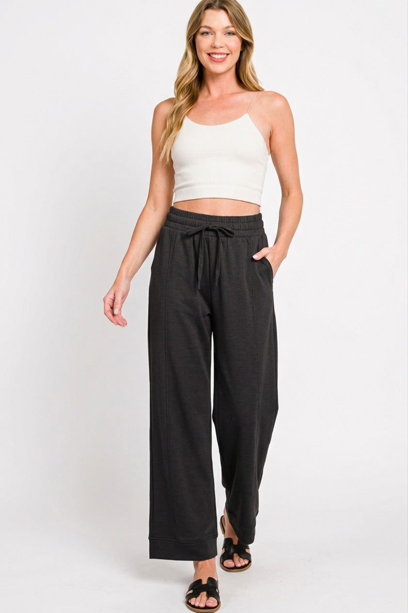 Black scuba drawstring pants, relaxed wide-leg fit with side pockets