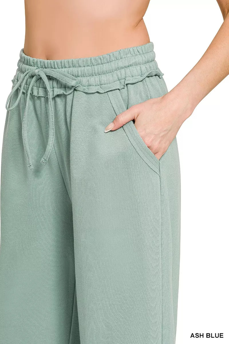 Ash blue wide-leg sweatpants detail: tie waistband and side seam pocket