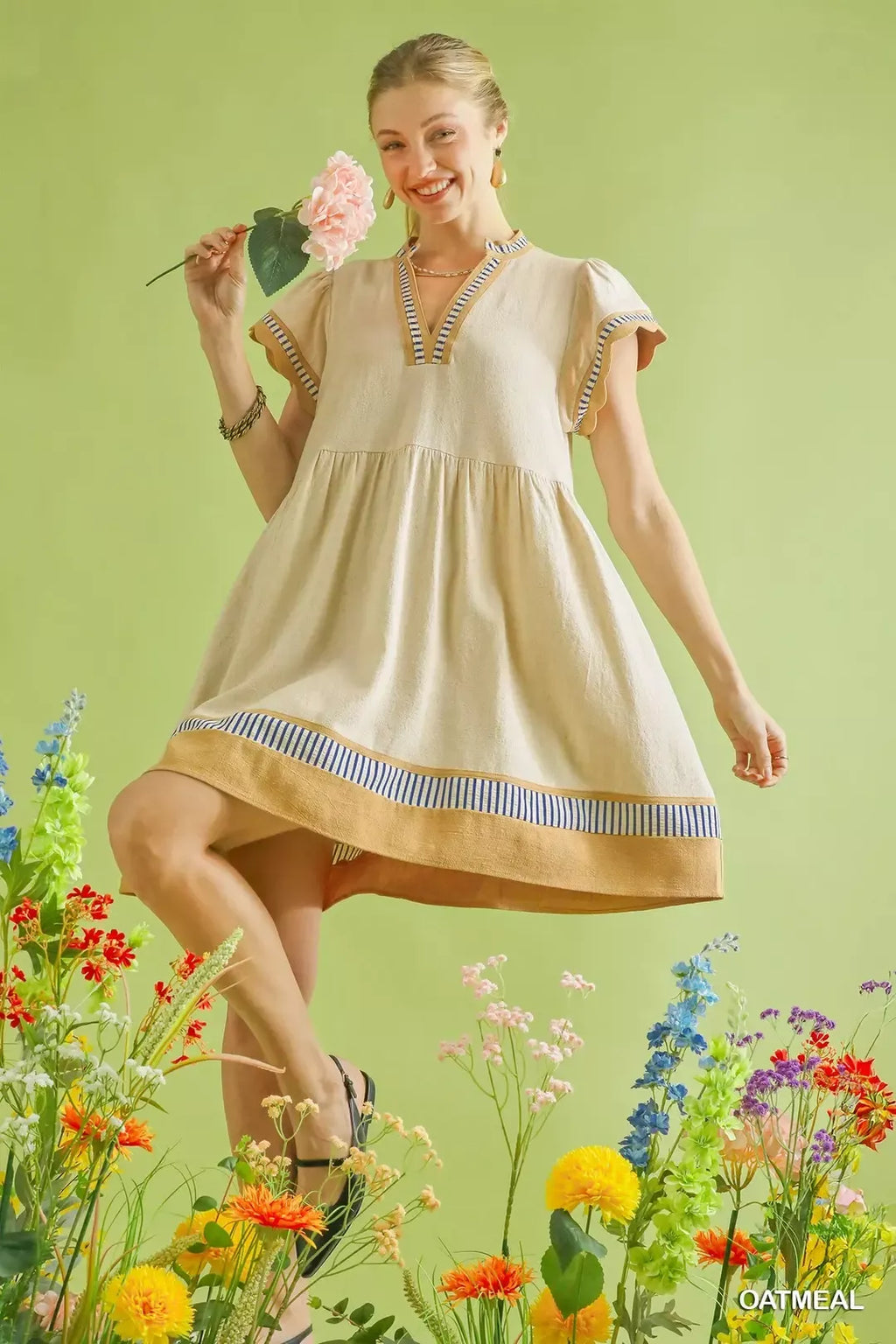 Oatmeal linen babydoll dress with flutter sleeves and blue striped bottom band