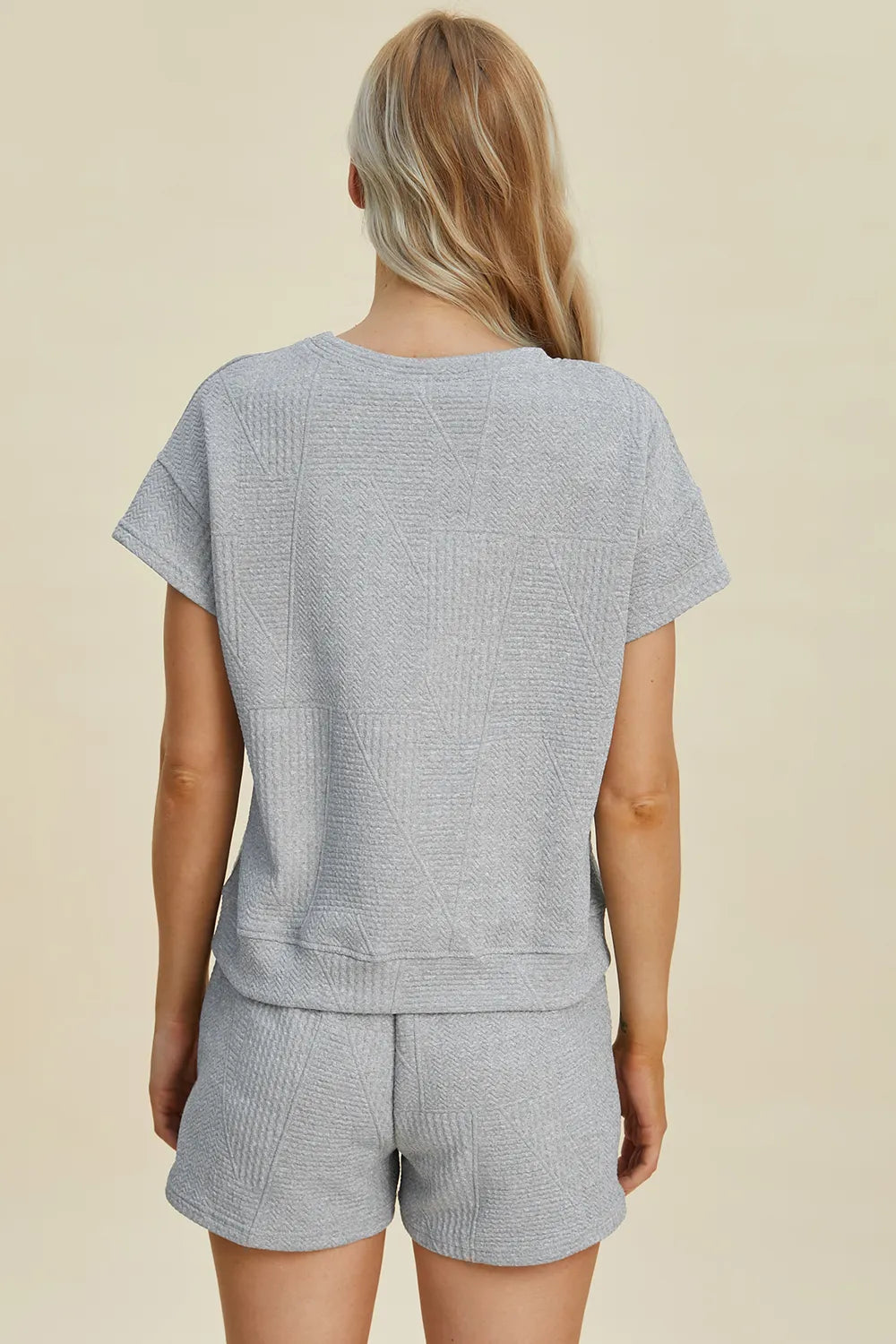 Cerulean blue texture set, back view of short-sleeve top and matching drawstring shorts