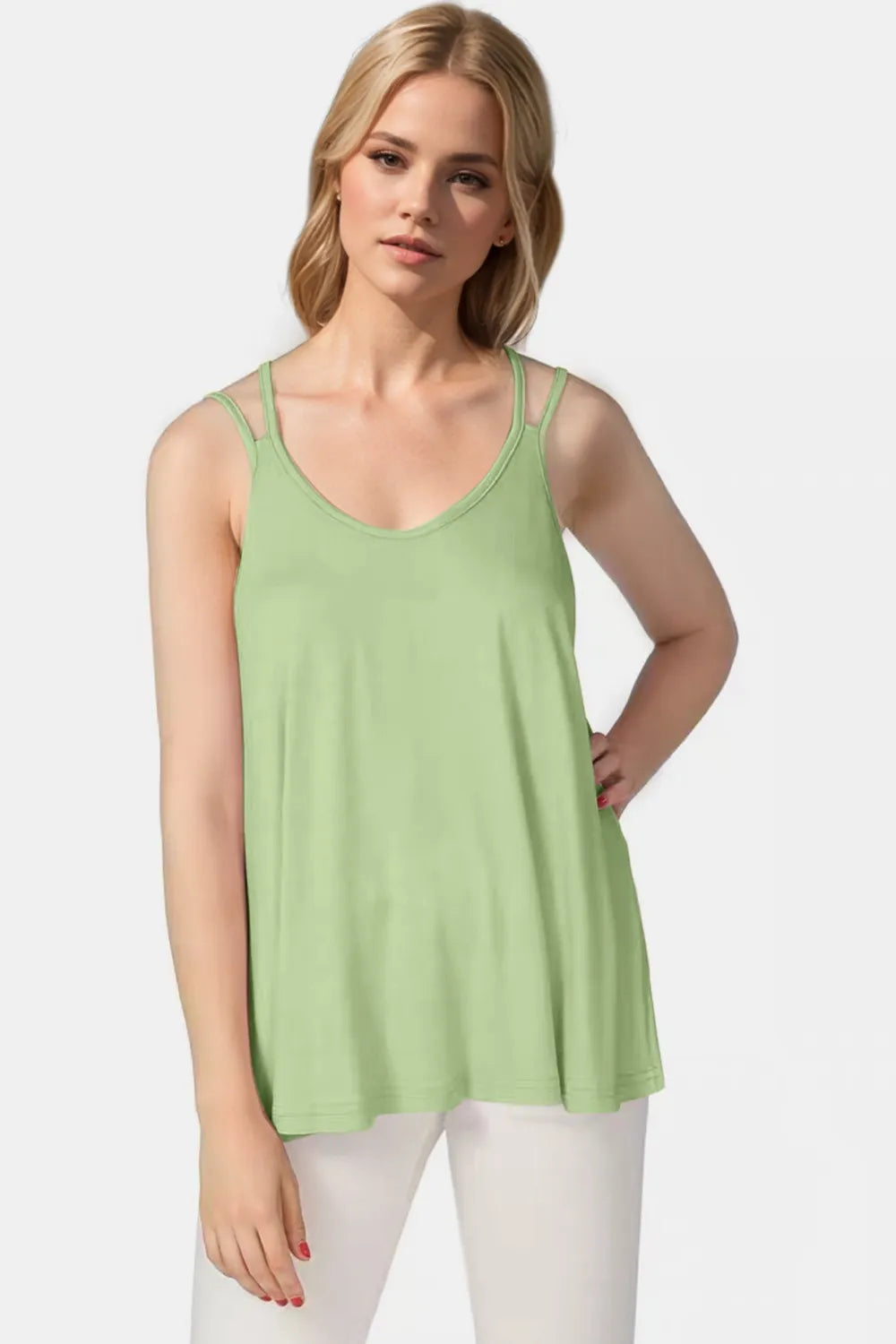Green cami with scoop neck and double spaghetti straps, swing hem, front view.