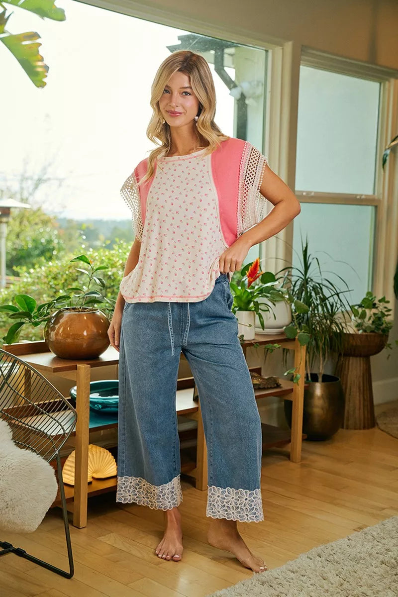 Washed denim pull-on pants with drawstring waist and flower lace trim at the wide cuffs