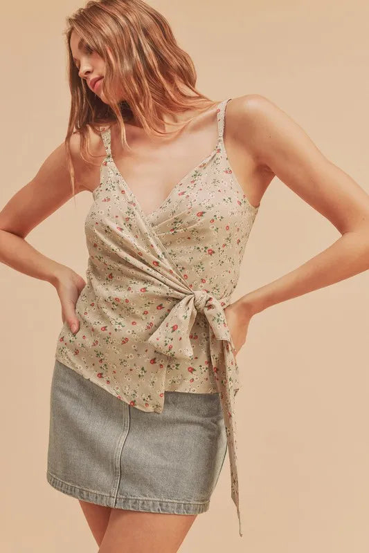 Side view of ditsy floral surplice cami with draped tie hem and thin straps