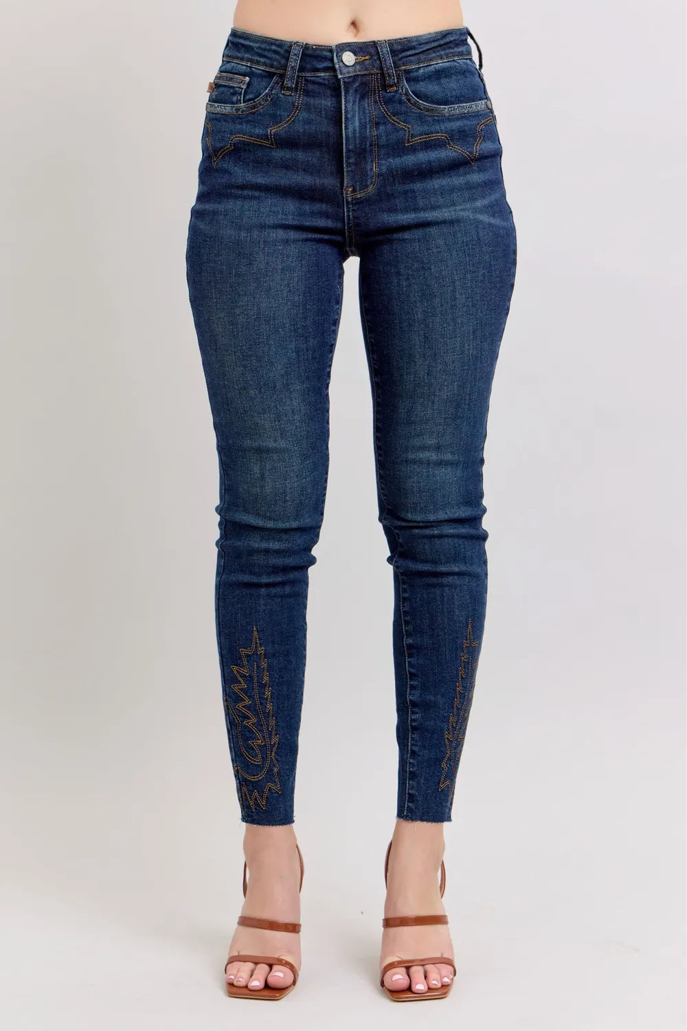 Dark blue high-rise skinny jeans with embroidered side panel detail, plus size