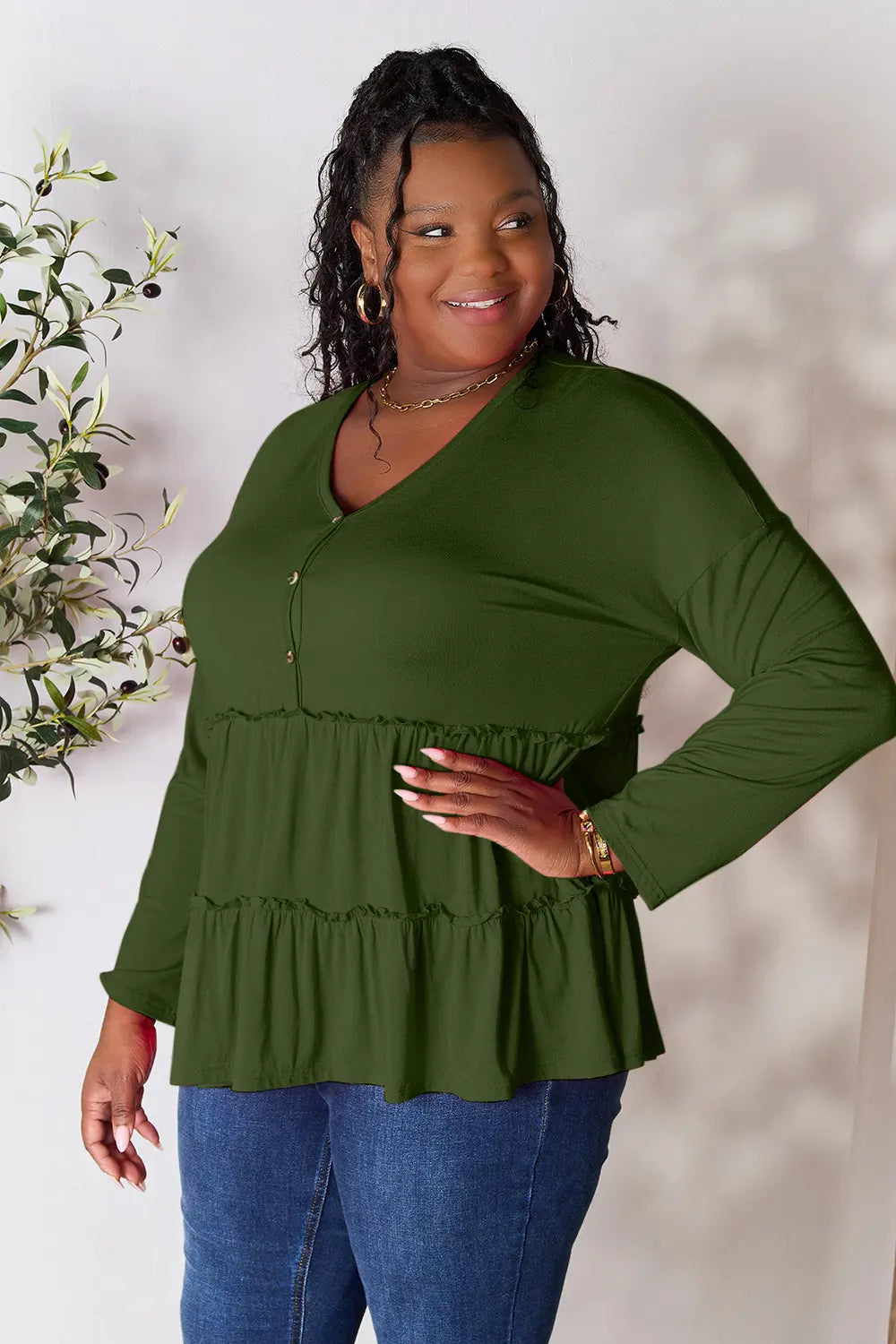 Army green long sleeve blouse with half-button front and tiered ruffle hem