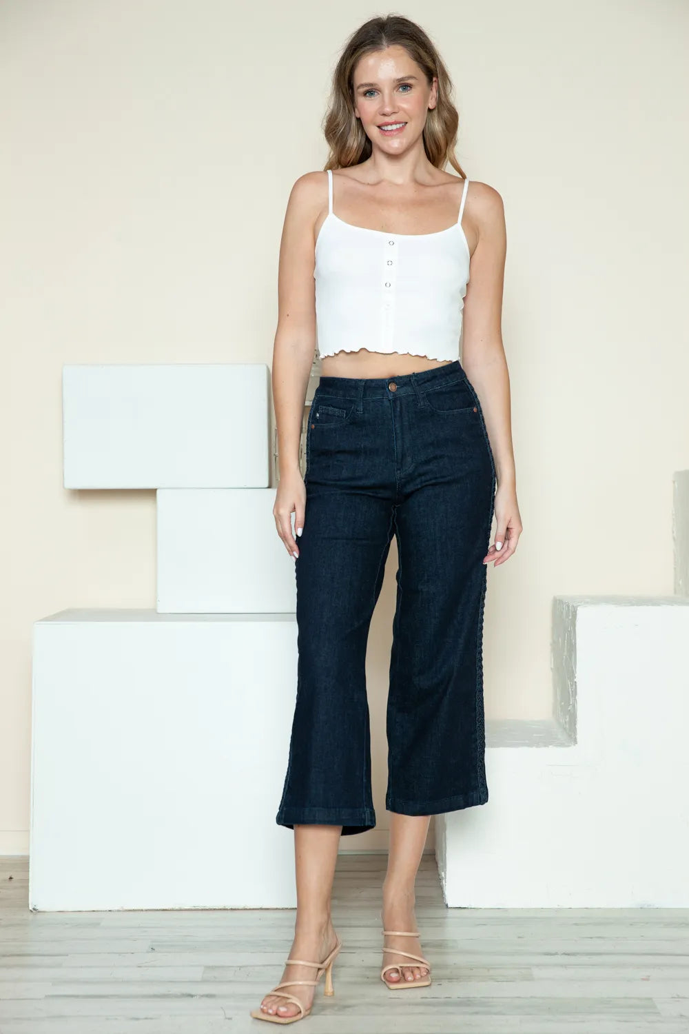 Dark crop wide-leg jeans, front view; relaxed straight legs with cropped hem