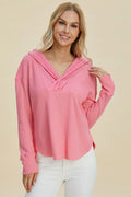 Pink hooded long-sleeve hoodie with draped crisscross neckline and relaxed fit