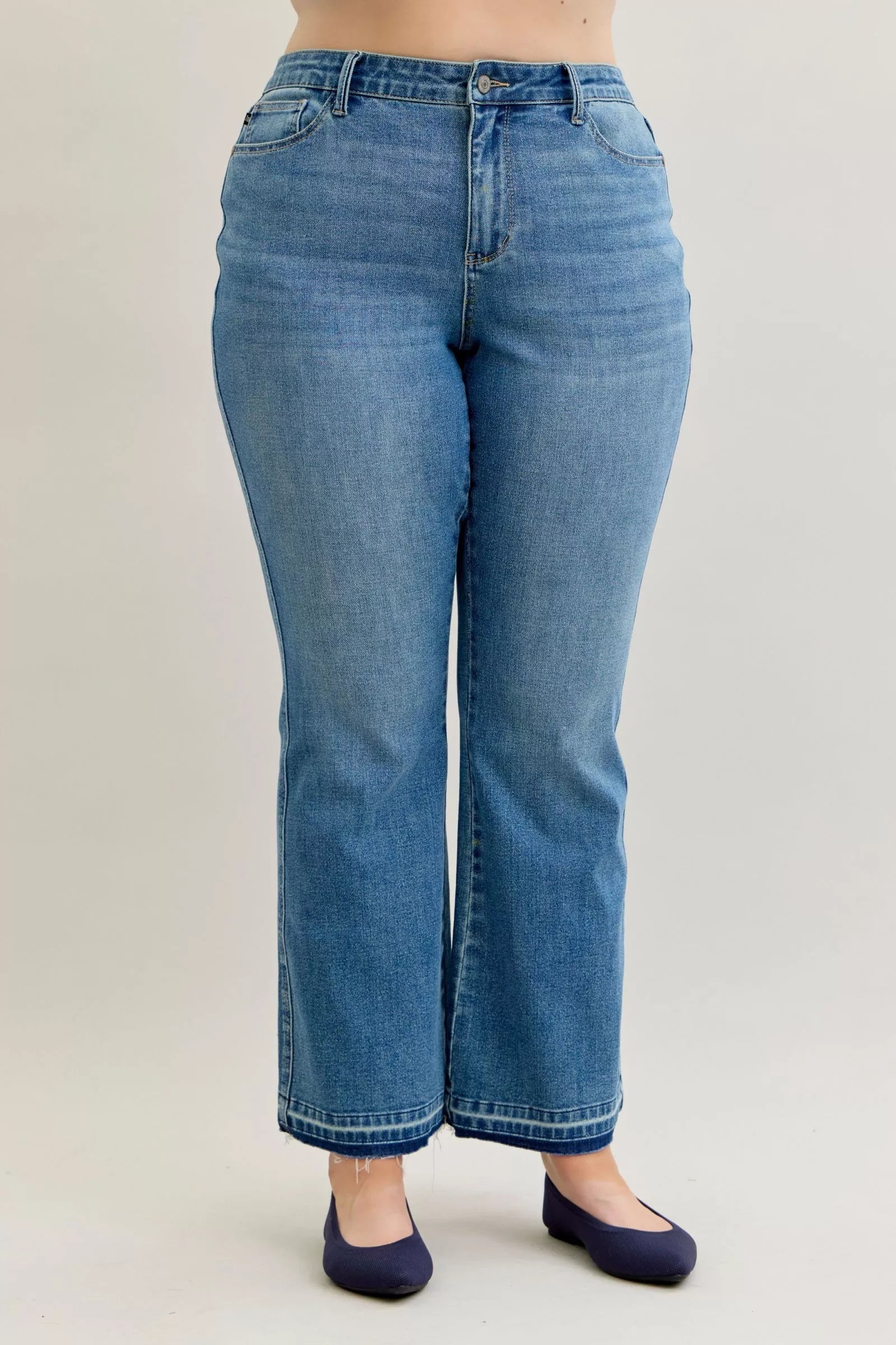 Light blue denim bootcut jeans, full back view with belt loops and seams