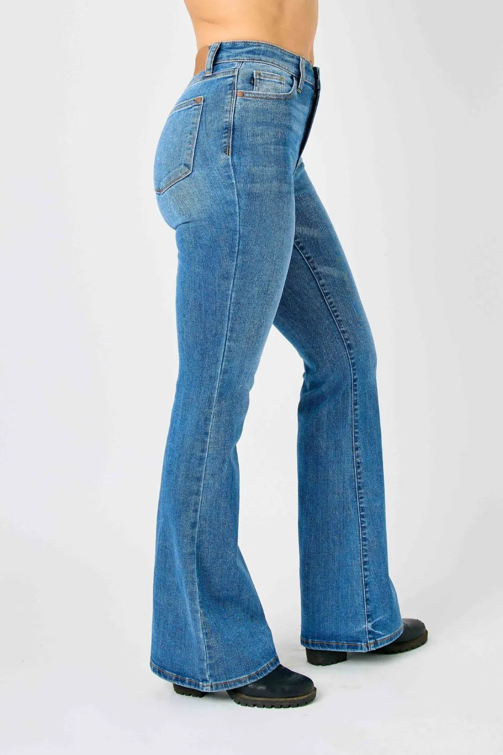 Side view of medium-blue high-waisted flare jeans with wide bootcut leg