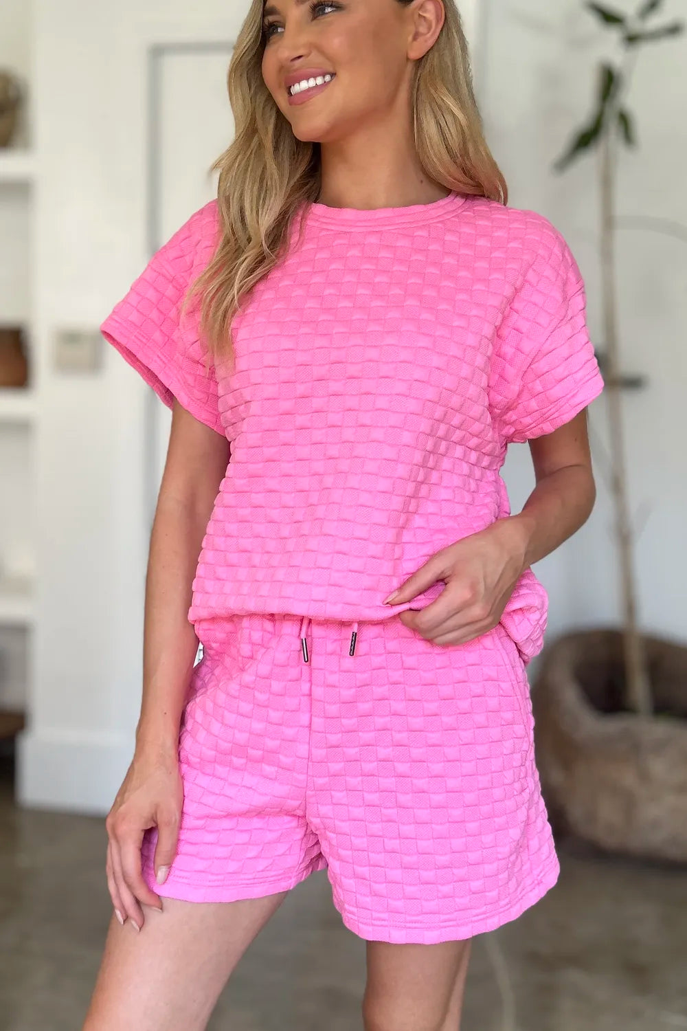 Pink textured tee and shorts set with short sleeves and matching adjustable waist drawstring