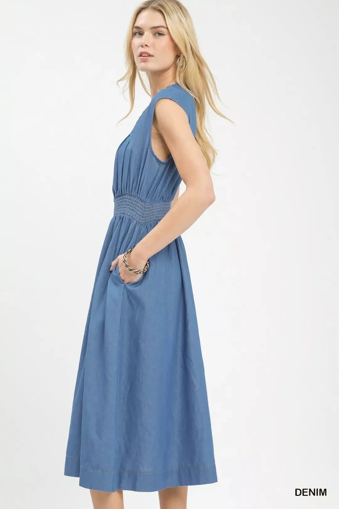 Denim midi dress sleeveless with smocked waist and front zipper, side view
