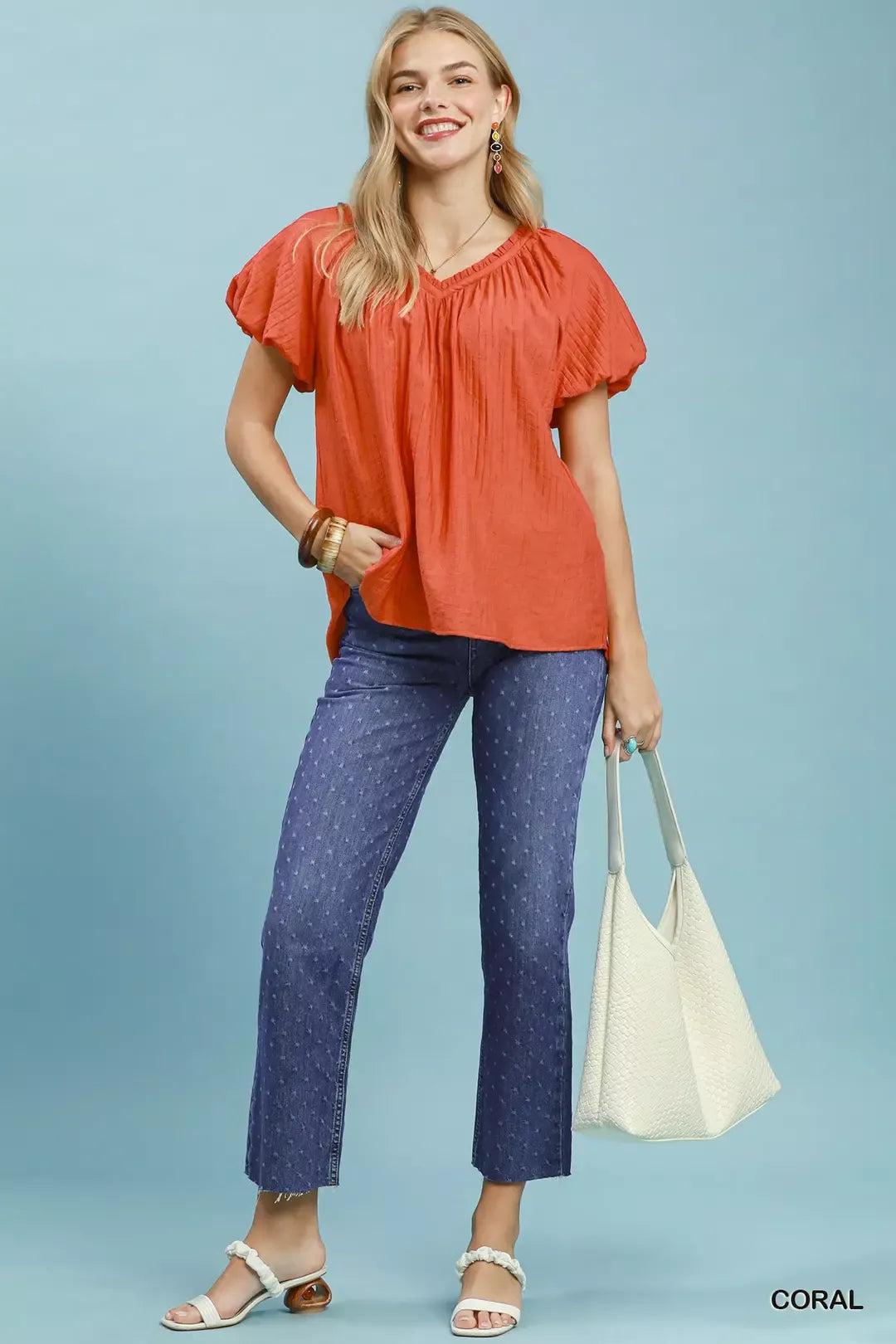 Coral gathered V-neck top with short puff sleeves, hip-length