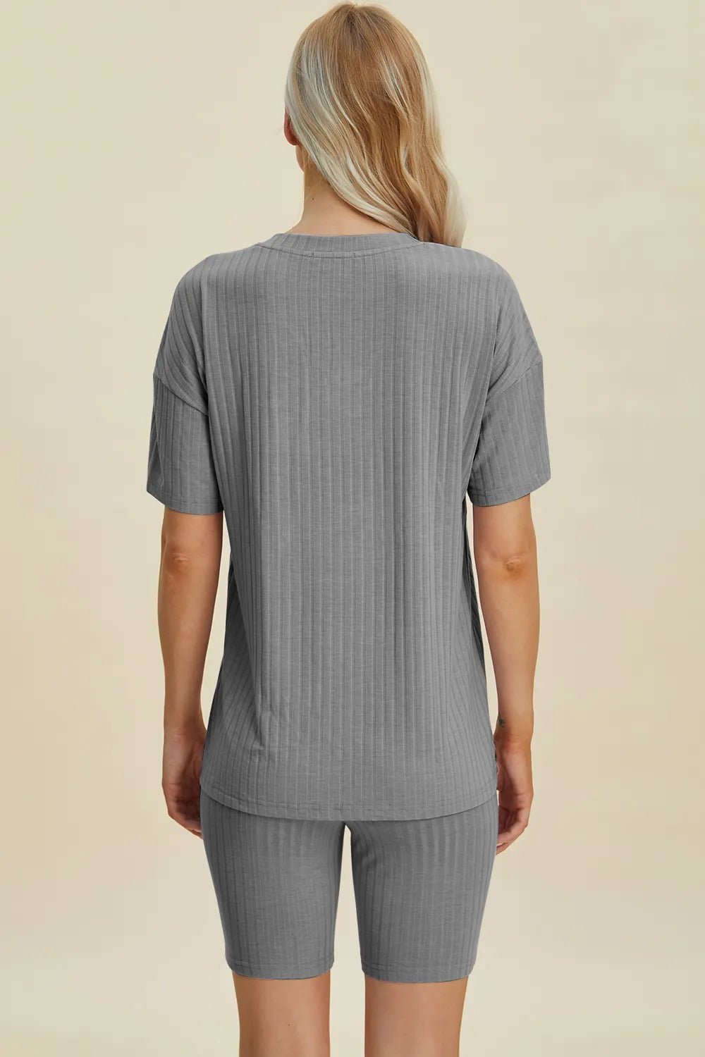 Gray ribbed V-neck short sleeve top and matching biker shorts set, back view